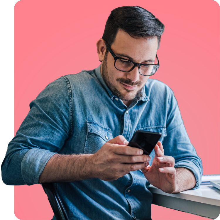 Man using smartphone to access HIV and STI testing services with Q Care Plus.