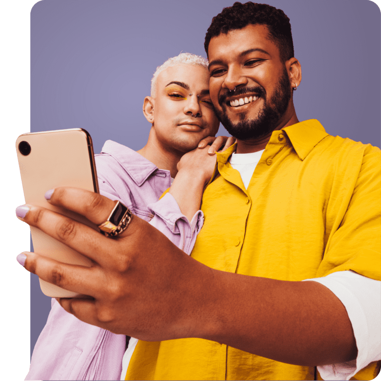 Two men looking up STI prevention and treatment options on a smartphone