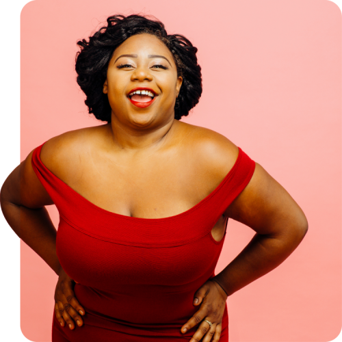 PrEP for Women – Take Control of Your Sexual Health Confident woman in a red dress smiling against a pink background, representing empowerment and HIV prevention with PrEP for women.